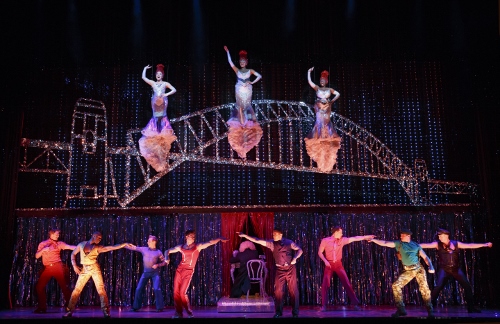 Center left to right (flying): Emily Afton, Brit West and Bre Jackson and Company in the number 'It's Raining Men'