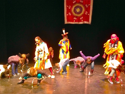 Children reaching for the feather prize in the Contest Dance, January 31, 2015
