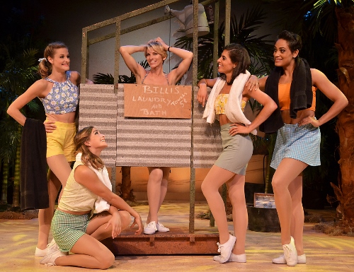 Nellie (Deb Wims), center, sings 'I'm Gonna Wash That Man Right Outa My Hair' with the nurses in Beef & Boards Dinner Theatre's production of South Pacific. The Rodgers & Hammerstein musical is now on stage through Oct. 4. Tickets include Chef Odell Ward's dinner buffet.