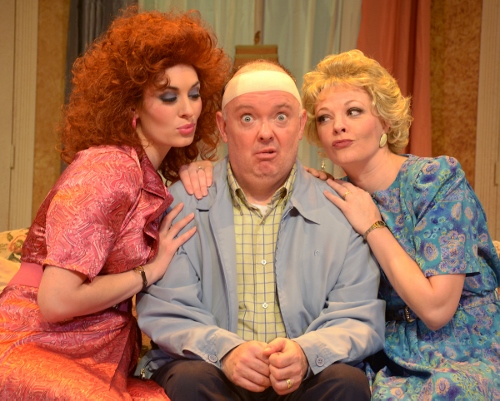 John Smith (Eddie Curry), center, seems like an ordinary cab driver, but he’s leading a double life in Beef & Boards Dinner Theatre’s production of Run for Your Wife. Married to both Barbara (Erin Cohenour), left, and Mary (Sarah Hund), right, John has been able to keep things in balance thanks to his precise schedule. But it all begins to unravel when that schedule gets disrupted one day, and John goes to great lengths to maintain wedded bliss with both of his wives – with hilarious results!