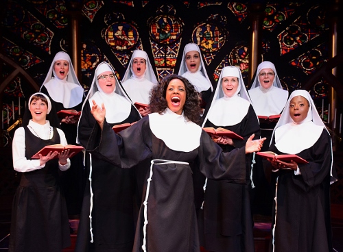 Lounge singer Deloris Van Cartier (Zuri Washington), center, teaches the nuns of Queen of Angels Church a new way to sing the Lord’s praises in Beef & Boards Dinner Theatre’s production of Sister Act, now on stage through March 25. Broadway’s divine musical comedy is based on the film of the same name that starred Whoopi Goldberg in the role of Deloris.