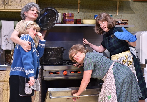 Vivan Snustad (Licia Watson), at left in back, savors the pungent aroma as she lifts the lid from a pot of lutefisk, a traditional Lutheran preparation of cod, in Beef & Boards Dinner Theatre’s current production of 'Church Basement Ladies.' Unable to share her enthusiasm for the dish are (from left) Signe Engelson (Lindsay Sutton), Mavis Gilmerson (Karen Pappas) and Karin Engelson (Dawn Trautman). The hilarious musical comedy is live on stage through Aug. 21.