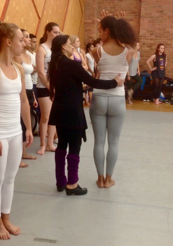Choreographer Jacqulyn Buglisi assisting a dancer.