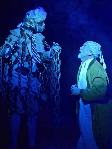 The ghost of his business partner Jacob Marley (Joshua L.K. Patterson), left, visits Ebenezer Scrooge (Jeff Stockberger) on the night of Christmas Eve in Beef & Boards Dinner Theatre’s one-hour production of 'A Christmas Carol'.