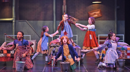Hard Knock Life: The orphans sing about their “Hard Knock Life” in Beef & Boards Dinner Theatre’s production of Annie, now on stage through July 15.