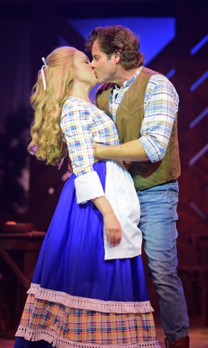 After proposing to Milly (Krista Severeid), Adam Pontipee (Tony Lawson) kisses her in Seven Brides for Seven Brothers, now on stage at Beef & Boards Dinner Theatre through Oct. 7. The real-life husband and wife star in this rip-roaring stage version of the classic MGM film that bursts with energetic dance numbers and famous songs including “Wonderful, Wonderful Day,” “Bless Your Beautiful Hide,” and “Goin’ Courting.”