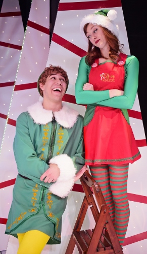 After being taken to the “North Pole” at Macy’s, Buddy (Dan Bob Higgins), left, sees Jovie (Emily Grace Tucker), right, and is overcome by her beauty in Beef & Boards Dinner Theatre’s production of Elf, The Musical, now on stage through Dec. 31.