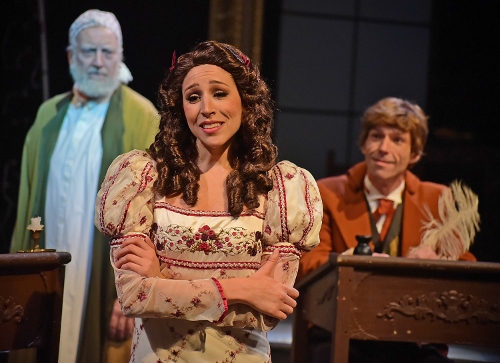 Belle (Jenny Reber), center, realizes her fiancé young Ebenezer Scrooge (Michael Shelton), right, has changed and decides to break off their engagement as the present-day Scrooge (Jeff Stockberger), left, watches in dismay in Beef & Boards Dinner Theatre’s production of A Christmas Carol, on stage select dates through Dec. 21.