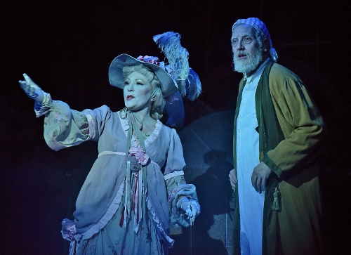 The Ghost of Christmas Past (Vickie Cornelius Phipps), left, visits Ebenezer Scrooge (Jeff Stockberger) in the middle of the night on Christmas in Beef & Boards Dinner Theatre’s production of A Christmas Carol, on stage select dates through Dec. 21.