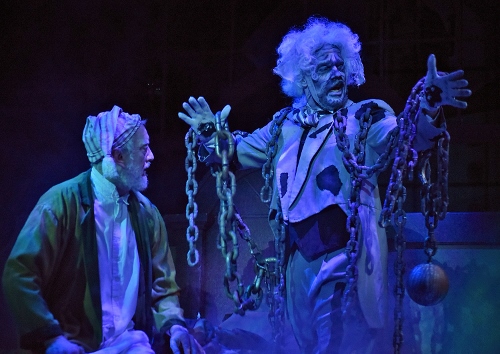 The ghost of Jacob Marley (Lance Gray), right, visits his former partner Ebenezer Scrooge (Jeff Stockberger) to warn him that three spirits will visit him through the night in Beef & Boards Dinner Theatre’s production of A Christmas Carol, on stage select dates through Dec. 21.