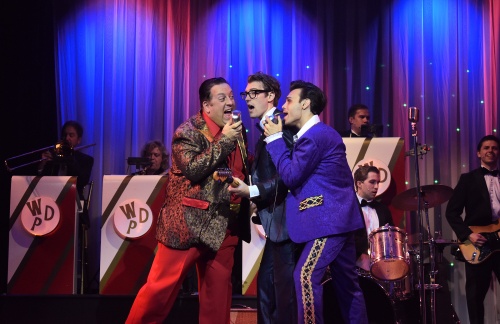 The Big Bopper (Chuck Caruso), Buddy Holly (Kyle Jurassic), and Ritchie Valens (Edward LaCardo) sing together during the concert in Clear Lake, Iowa, in Beef & Boards Dinner Theatre’s production of Buddy: The Buddy Holly Story, now on stage. This high-energy musical features Buddy’s greatest hits including “Oh Boy,” “Peggy Sue,” and “Everyday.”