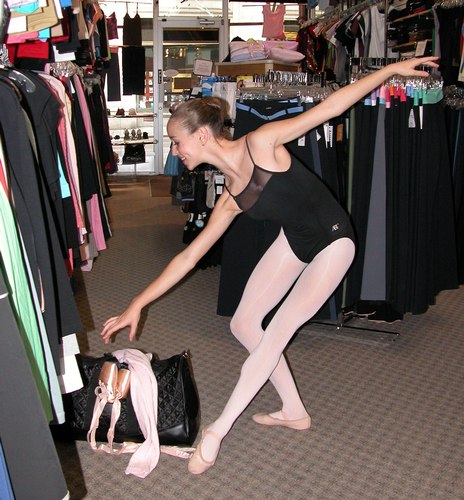 Black ABT Leotard by Capezio. Black quilted satin bag by Capezio. Modeled by Skylar Brandt. Available at <a href='http://www.onstagedancewear.com'>OnStageDancewear.com</a>.