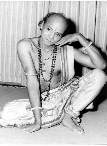 Guru Kelucharan Mohapatra one of the architects of modern Odissi dance, (teacher of the founder of Nrityagram, Protima Bedi) in a seated pose which captures lines of the feminine body.
