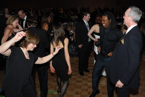 Claire Bataille, one of the four original HSDC dancers and currently Associate Director of the Lou Conte Dance Studio at the Hubbard Street Dance Center, dances with former HSDC dancer Geoff Myers and Spotlight Ball committee member Jonathan Goldman