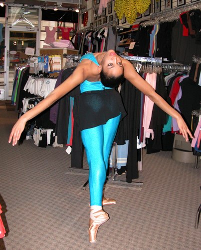 Kimberly is wearing a Electric Blue Unitard, Style 7931-NL, $59.99; and a Black Danskin New York City Ballet Collection Short Wrap Skirt, Style 934, $26.99. Available at <a href='http://www.onstagedancewear.com'>OnStageDancewear.com</a>.