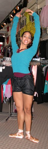 Kimberly is wearing Black Bloomers Pants, Body Wrappers, Style 746, $19.99; Cross Over Neck Leotard, Color GNT, Style P500 from the Premiere Collection by Body Wrappers, $39.99; and a Green, Echauffement from the Knits Collection by Sansha, Style K5406, $39.99. Available at <a href='http://www.onstagedancewear.com'>OnStageDancewear.com</a>.