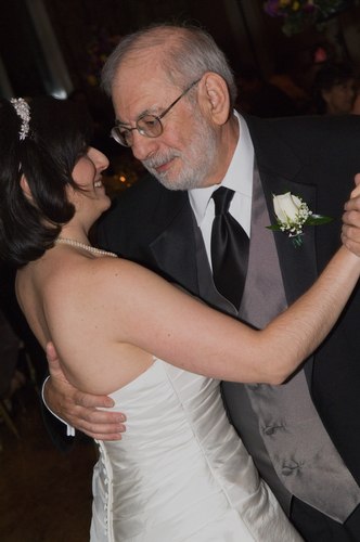 Sima dances with her father, Manny