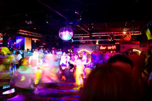 Dancing on Wheels beneath a Mirror Ball at the Down & Derby Roller Disco